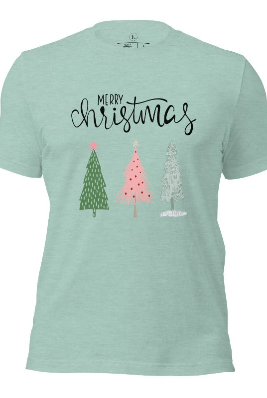 Elevate your festive wardrobe with our trendy shirt and make a chic statement this Christmas. The design features a stylish "Merry Christmas" message along with modern pink and teal Christmas trees on a heather prism blue shirt. 
