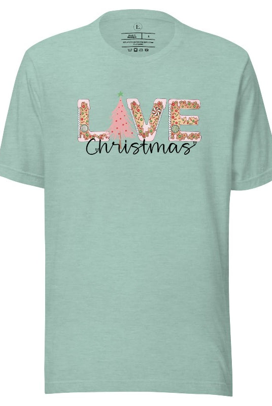 Get ready to celebrate the holiday season in style with our Christmas shirt featuring cute gingerbread cookies arranged to spell out the word "Love" on a heather prism dusty blue colored shirt.