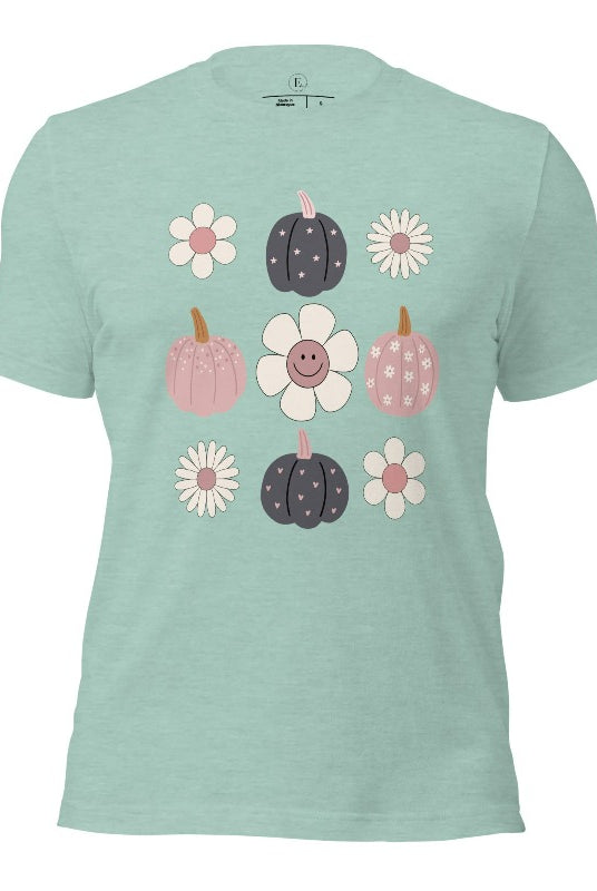 Step into retro autumn vibes with our trendy t-shirt. Featuring a delightful combination of pumpkins and retro flowers, on a heather prism dusty blue shirt. 