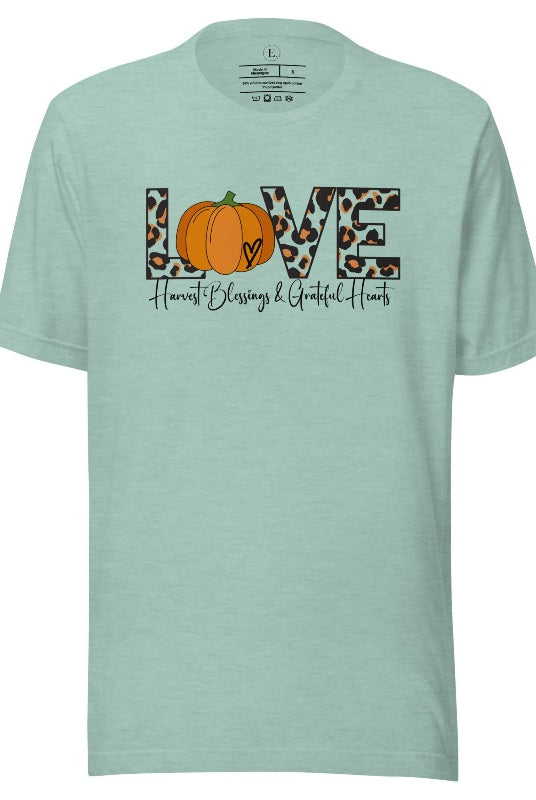 Spread love and autumn vibes with our trendy t-shirt. Featuring the word 'love' in cheetah print with a pumpkin as the 'o,' and "Harvest Blessings and Grateful Hearts' underneath on a heather prism dusty blue shirt. 