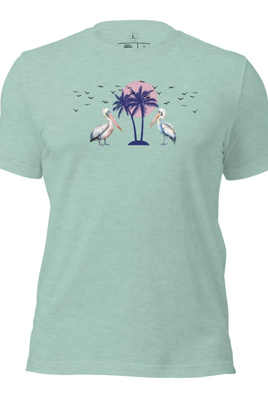 Elevate your beach style with our Beach shirt featuring two majestic pelicans facing each other. Set against a backdrop of a breathtaking sunset and a swaying palm tree on a heather prism dusty blue shirt. 