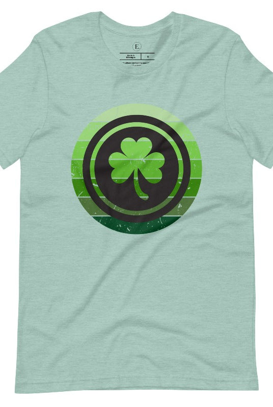 Get your ultimate Saint Patrick's Day attire with our Bella Canvas 3001 unisex graphic t-shirt! Featuring a captivating circle design in various shades of green, topped with a prominent shamrock, on a heather prism dusty blue shirt.