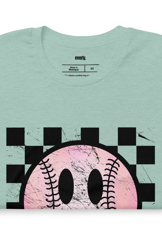 Retro softball smiley face on a heather prism mint graphic tee.