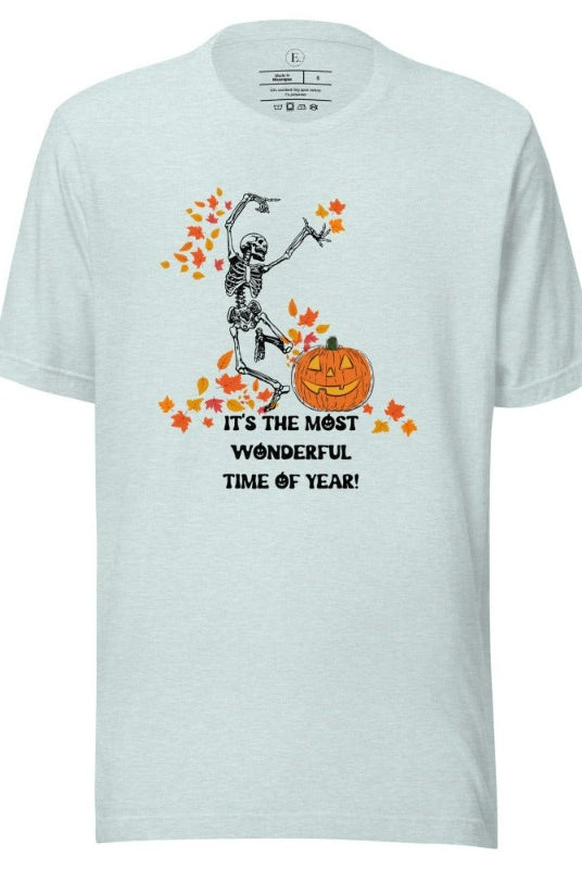 Dancing Skeleton in fall leaves with a jack-o-lantern with saying "It's the most wonderful time of year" on a heather prism ice blue colored shirt.