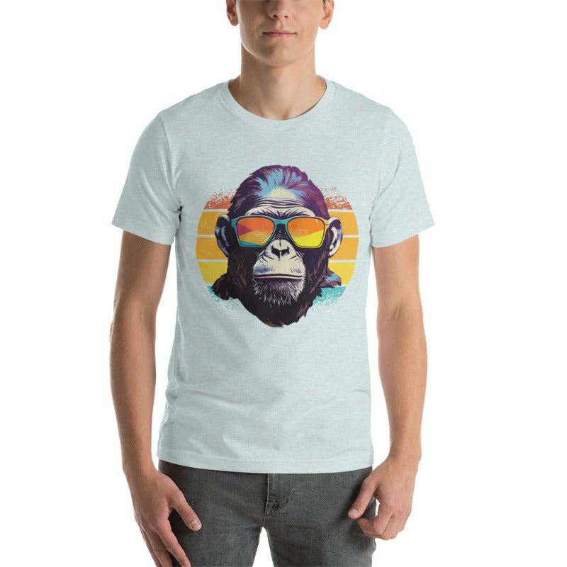 A gorilla wearing sunglasses Infront of a retro sunset on a heather prism ice blue colored shirt.