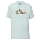 Express gratitude in style with our charming t-shirt. This design radiates autumn appreciation, featuring three pastel pumpkins and the word 'thankful' gracefully woven through the middle on a heather prism ice blue colored shirt. 