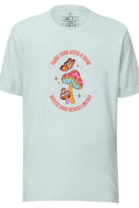 Embrace the beauty of nature with our mushroom and butterfly shirt. Featuring a captivating design of a mushroom and butterfly, it symbolizes growth and transformation. With the inspiring message "Plant your seed and grow watch your beauty unfold," on a heather prism ice blue shirt. 