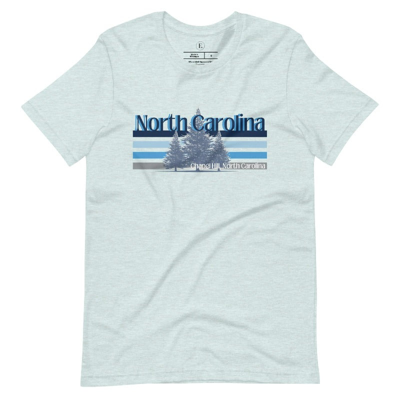 Show your school pride with this iconic North Carolina wordmark t-shirt. Made from premium materials, it features a North Carolina tree line in a the cool Carolina blue colors, representing a tradition of excellence for the nature that North Carolina offers on a heather prism ice blue shirt. 
