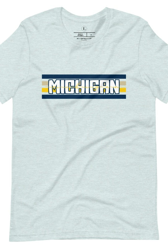 Elevate your collegiate style with our Michigan University graphic tee featuring iconic school colors and bold chest stripes. Emblazoned with "Michigan" in striking lettering, on a heather prism ice blue shirt. 