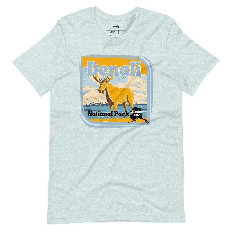 Heather Prism Ice Blue Bella + Canvas 3001 t-shirt featuring a colorful Denali National Park graphic with a moose and mountains, showcasing the beauty of Alaska's wilderness.