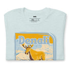 Heather Prism Ice Blue Bella + Canvas 3001 t-shirt featuring a colorful Denali National Park graphic with a moose and mountains, showcasing the beauty of Alaska's wilderness.