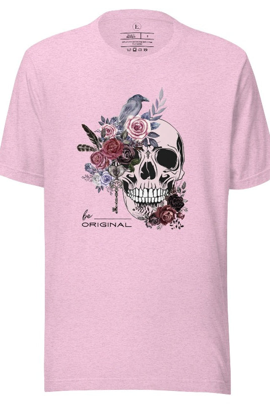 Looking for a unique Halloween shirt? Look no further! Our hauntingly beautiful shirt features a floral skull, raven, and the empowering slogan 'Be Original'. Stand out from the crowd with this unforgettable statement piece on a heather prism lilac shirt. 