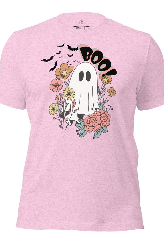 Get ready for Halloween with our cute and spooky ghost-themed shirt! Featuring a whimsical design with a cute ghost, flowers, and bats in a starry sky, it's the perfect blend of spooky and sweet on a heather prism lilac shirt. 