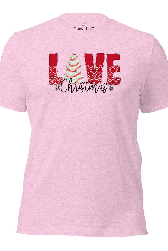 Spread love and joy this holiday season with our Christmas shirt featuring the classic Christmas tree cake, which is incorporated into the word "Love" on a heather prism lilac colored shirt.
