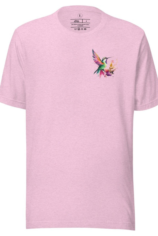 Elevate your style with our stunning t-shirt featuring a watercolor hummingbird delicately placed on the pocket on a heather prism lilac shirt. 