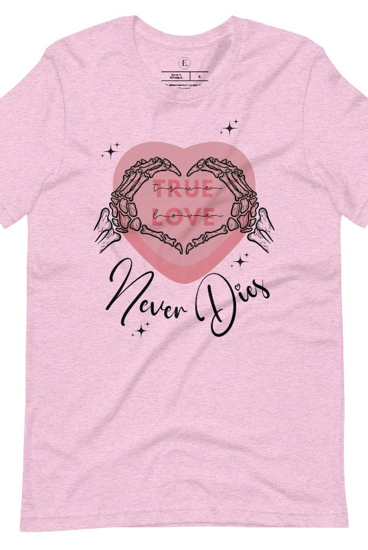 Embrace the unconventional with our Valentine's Day shirt featuring the bold statement "True Love, Never Dies" adorned with a heart and skeleton hands forming a heart shape on a heather prism lilac shirt. 
