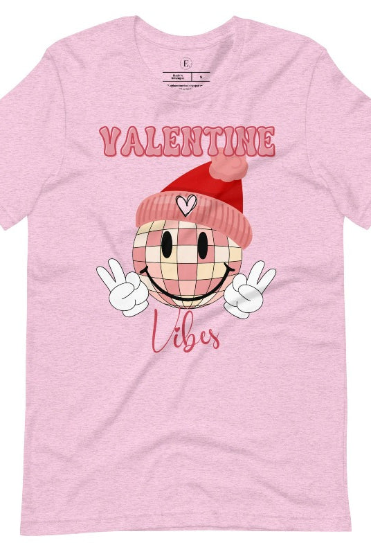 Get into the Valentine's Day spirit with our fun and funky shirt donning the words "Valentine Vibes" alongside a disco ball smiley face flashing peace fingers on a heather prism lilac shirt. 