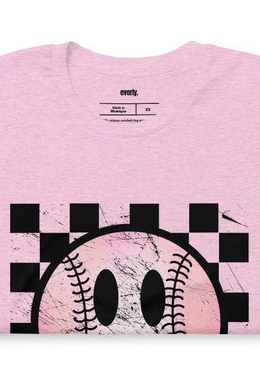 Retro softball smiley face on a heather prism lilac graphic tee.