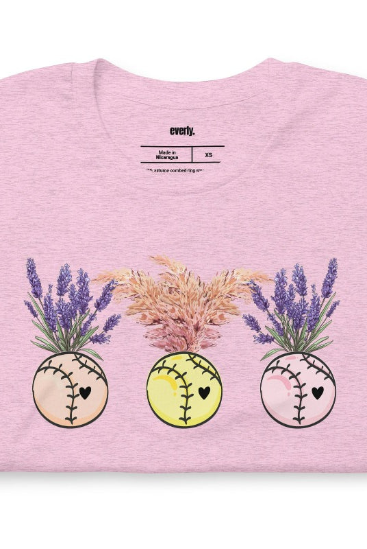 Softball flower vases holding flowers on a heather prism lilac graphic tee.