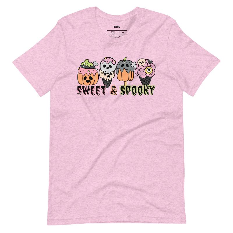 Pink t-shirt featuring a fun 'Sweet & Spooky' design with Halloween-themed ice cream cones, skulls, pumpkins, and spooky treats.