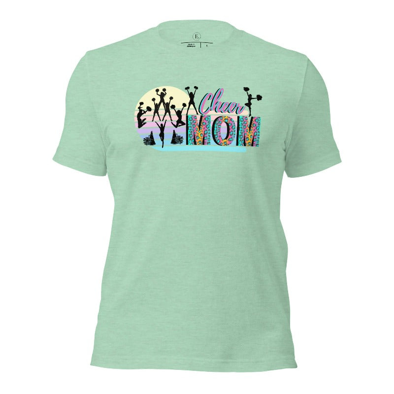 Get your cheer on with our stylish cheer mom shirt. Perfect for proud moms supporting their cheering stars. Made with love, this shirt combines comfort and fashion, letting you show off your team spirit. Join the cheer squad and cheer your heart out in style on a heather prism mint shirt. 
