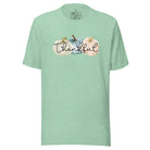 Express gratitude in style with our charming t-shirt. This design radiates autumn appreciation, featuring three pastel pumpkins and the word 'thankful' gracefully woven through the middle on a heather prism mint colored shirt. 