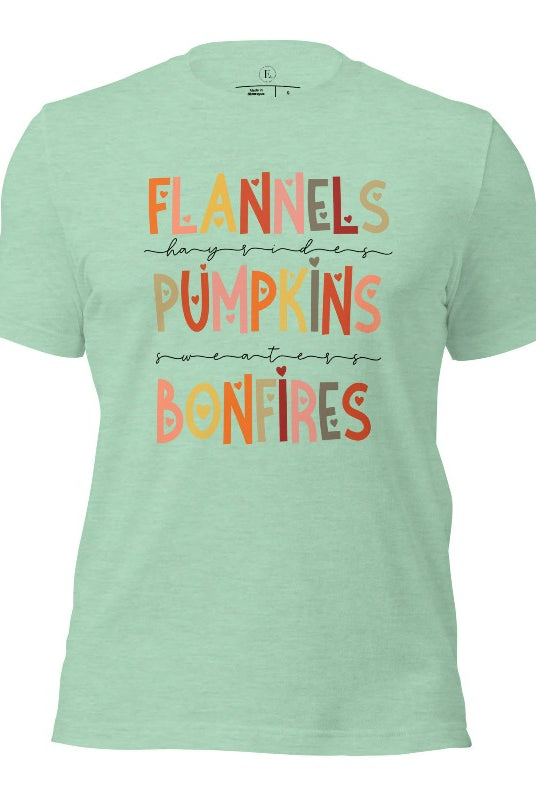 Embrace the cozy spirit of fall with our Flannel, Hayrides, Pumpkins, Sweaters, Bonfires shirt. Featuring the iconic fall elements, this shirt celebrates the season of warmth and comfort on a heather prism mint shirt. 