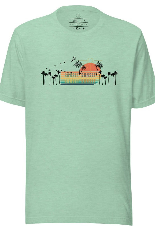 Transport yourself to a nostalgic beach getaway with our Retro Beach Shirt. Adorned with a captivating scene of a vintage sunset, palm trees, and seagulls soaring above on a heather prism mint shirt. 