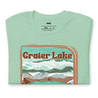 a colorful graphic of Crater Lake National Park, featuring mountains, water, and the text "Crater Lake National Park Oregon 1902 on a mint shirt. 