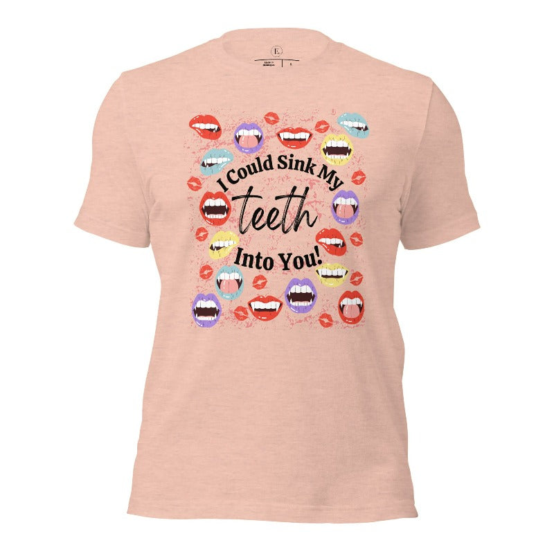 Sink your teeth into Halloween style with our vampire lips shirt. Adorned with a collection of seductive vampire lips, this shirt mesmerizes with its allure. The cheeky message, 'I could sink my teeth into you,' adds a playful twist on a heather prism peach shirt. 