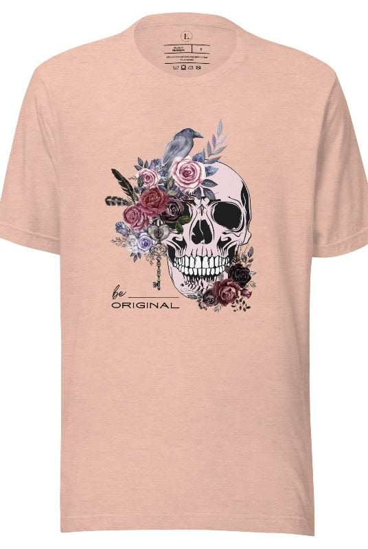 Looking for a unique Halloween shirt? Look no further! Our hauntingly beautiful shirt features a floral skull, raven, and the empowering slogan 'Be Original'. Stand out from the crowd with this unforgettable statement piece on a heather prism peach shirt. 