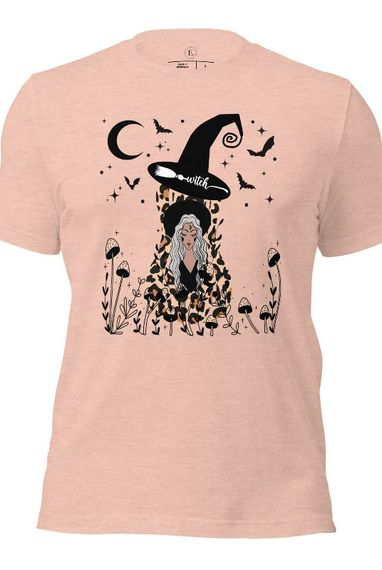 Elevate your Halloween style with our striking shirt featuring a cheetah print squash and a stylish lady donning a witch hat adorned with flowers and bats. Embrace the enchanting fusion of nature and magic on a heather prism peach colored shirt. 