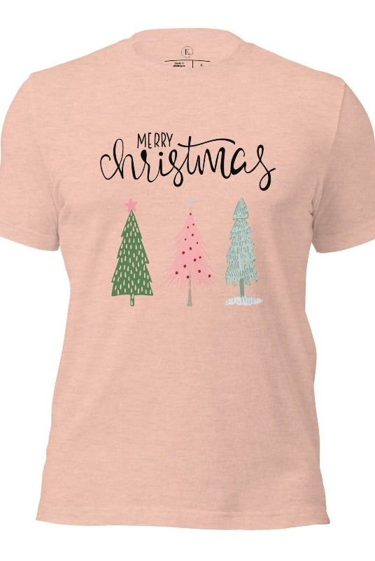 Elevate your festive wardrobe with our trendy shirt and make a chic statement this Christmas. The design features a stylish "Merry Christmas" message along with modern pink and teal Christmas trees on a heather prism peach shirt. 