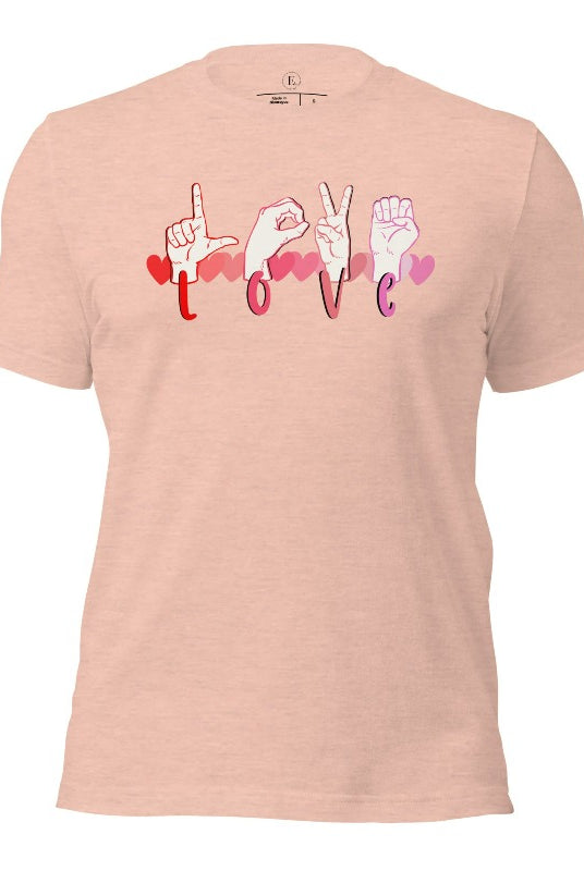Beautiful ASL hand gesture spelling out love with hearts on a heather prism peach colored shirt.