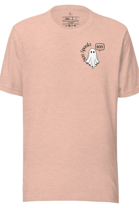 Get into the Halloween spirit with our spooktacular t-shirt. Featuring a friendly ghost holding a sign that says 'Boo' and the playful phrase "Stay Spooky"  on a heather prism peach shirt.