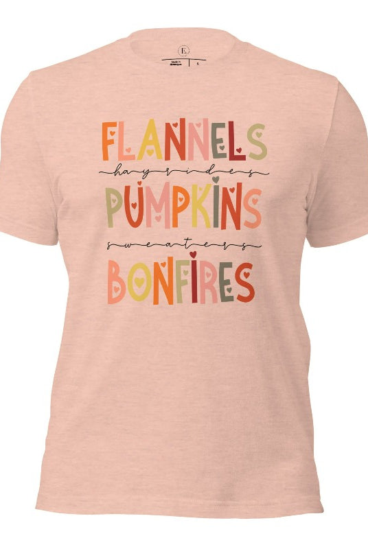 Embrace the cozy spirit of fall with our Flannel, Hayrides, Pumpkins, Sweaters, Bonfires shirt. Featuring the iconic fall elements, this shirt celebrates the season of warmth and comfort on a heather prism peach shirt. 