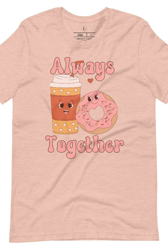 Celebrate love with our adorable Valentine's Day graphic tee! Featuring a smiling coffee cup and a cheerful donut holding hands, on a heather prism peach shirt. 