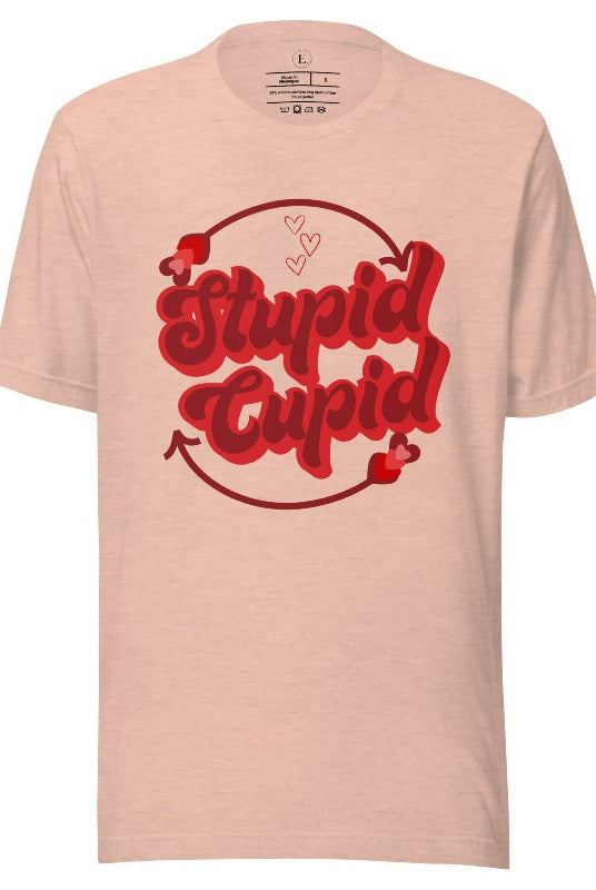 Express your Valentine's Day attitude with our bold and cheeky shirt proclaiming "Stupid Cupid" on a heather prism peach shirt. 