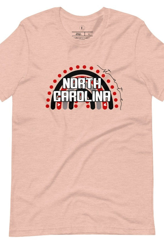 Looking for a way to show off your vibrant spirit? Look no further than this NC State University t-shirt. The NC State colors shine on a boho rainbow backdrop, representing the iconic North Carolina wordmark in a unique and trendy way on a heather prism peach shirt. 