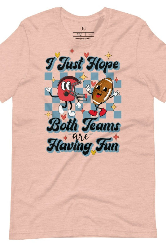 Dress in game day spirit with our Bella Canvas 3001 unisex tee! Featuring a retro design and the fun mantra, "I just hope both teams are having fun," on a heather prism peach shirt. 