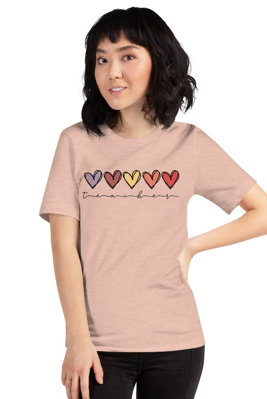 Modern heart design on a peach graphic tee with the word 'teacher' - perfect for teacher shirts and teacher gifts. Peach graphic tees.