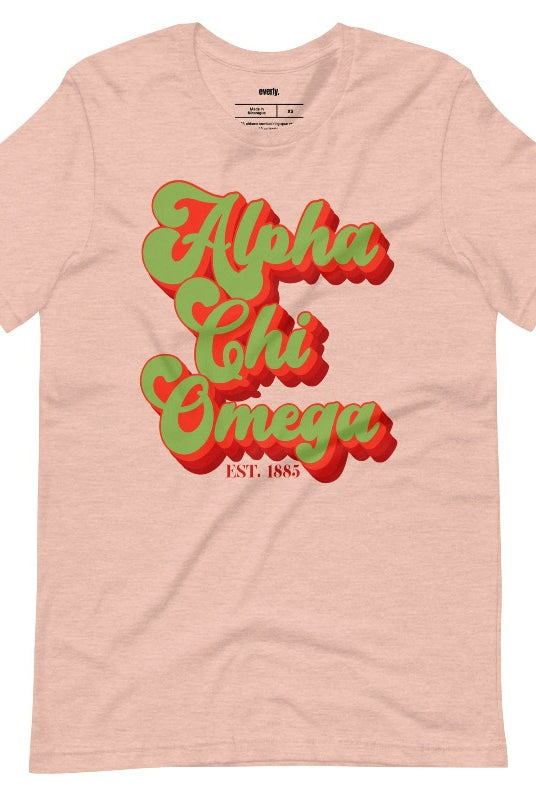 Get a retro-chic look with this Alpha Chi Omega Est 1885 graphic tee - a trendy choice for sorority shirts that combines timeless style with sisterhood pride. Peach graphic tee