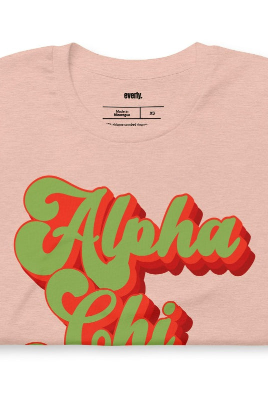 Get a retro-chic look with this Alpha Chi Omega Est 1885 graphic tee - a trendy choice for sorority shirts that combines timeless style with sisterhood pride. Peach graphic tee