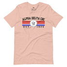 Heather peach graphic tee featuring the Alpha Delta Chi sorority letters and crest