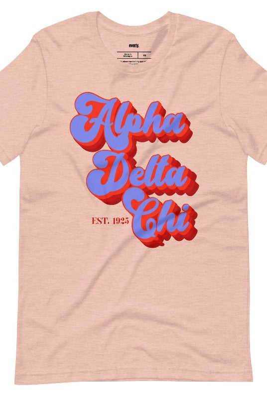 Heather peach graphic tee featuring 'Alpha Delta Chi' in retro lettering