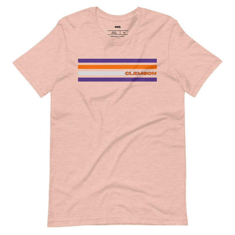 Bella + Canvas 3001 unisex T-shirt featuring a Clemson University design with purple, orange, and grey stripes and the word "Clemson" in bold orange letters on a peach shirt