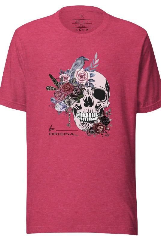 Looking for a unique Halloween shirt? Look no further! Our hauntingly beautiful shirt features a floral skull, raven, and the empowering slogan 'Be Original'. Stand out from the crowd with this unforgettable statement piece on a heather raspberry colored shirt. 