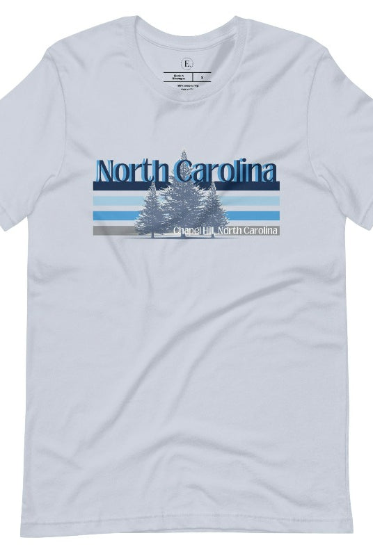 Show your school pride with this iconic North Carolina wordmark t-shirt. Made from premium materials, it features a North Carolina tree line in a the cool Carolina blue colors, representing a tradition of excellence for the nature that North Carolina offers on a light blue shirt. 