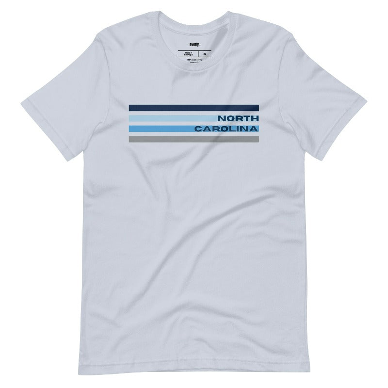 a design featuring blue stripes and "North Carolina" text on a light blue shirt.