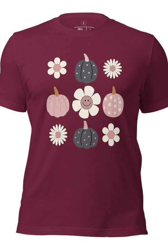 Step into retro autumn vibes with our trendy t-shirt. Featuring a delightful combination of pumpkins and retro flowers, on a maroon shirt. 